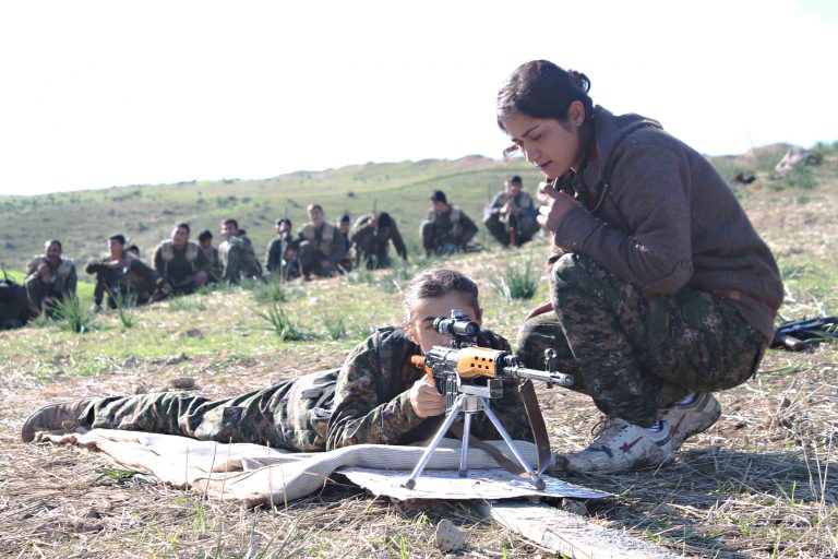 March 25, 2016 - Kurdistan, IRAQ - Women fighters with the Kurdish YPG learn how to use a heavy machine gun during training shown in a propaganda photo released by the YPG March 25, 2016 in Iraqi Kurdistan. The YPG or Peoples Protections Units are fighting the Islamic State in Syria and Iraq. (Credit Image: Global Look Press via ZUMA Press)