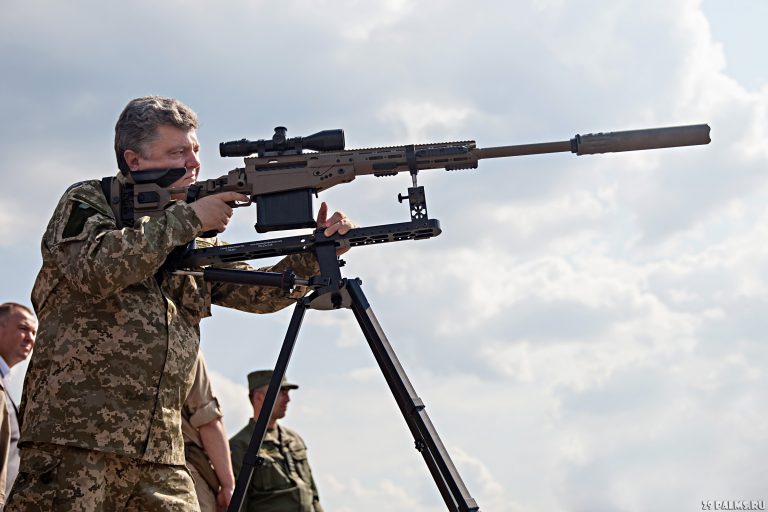 KIEV, UKRAINE - Jul 26, 2014: President of Ukraine Petro Poroshenko examined modern samples of arms and military machines that will be sent to the ATO area