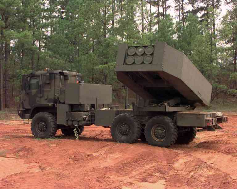 Soldiers from Charlie Company, 3/27 Field Artillery Regiment out of Fort Bragg, N.C., get ready to aim their High Mobility Artillery Rocket System (HIMARS) as part of the Rapid Force Projection Initiative Field Experiment (RFPI). This experiment is being used to test new equipment and its usefulness with the light forces in the field.  (U.S. Army photo by Spc. Russell J. Good) (Released)