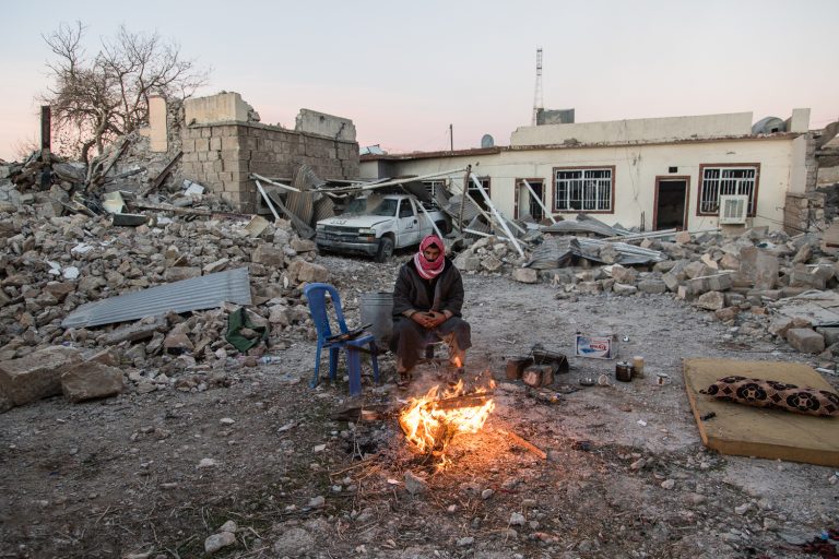 14/11/2015 -- Sinjar-Iraq, Iraq -- 

An Ezidy peshmerga fighter sit next a fire in early morning in Sinjar town.