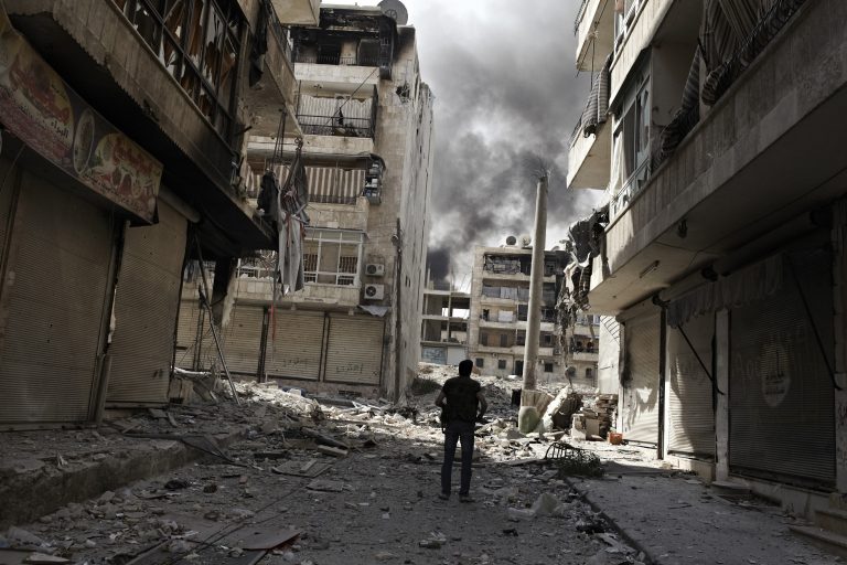 22 October 2012 - Aleppo, Syria - IMohamma Jaffar, patrols a street in Bustan Al Basha, one of Aleppo's most volatile front lines.
Mohammad Jaffar, also know, as Anadan, is a 17 years old FSA fighter. When his family fled to Turkey in July he decided to stay in Aleppo where he joined the Mutasm Bellah Katiba and begun to fight along Bustan Al Basha, one of Aleppo?s most kinetic front lines. He is the youngest member of his family, which is comprised of a father, mother and three sisters.

 Photo Credit: Sebastiano Tomada/Sipa USA