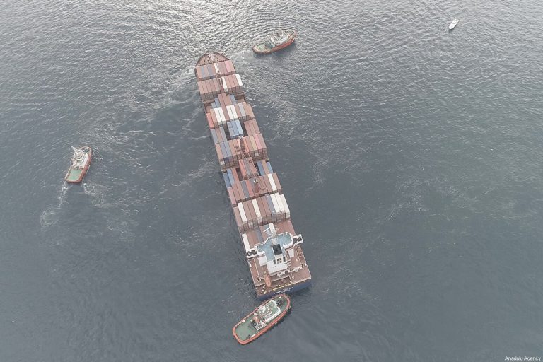 ISTANBUL, TURKEY - DECEMBER 27: Liberia-flagged cargo vessel; 'Songa Iridium' is seen removing with boats of Directorate General of Coastal Safety, in Istanbul, Turkey on December 27, 2019. A Liberia registered container ship ran ashore in Istanbul's Bosphorus and was rescued by boats. ( İslam Yakut - Anadolu Agency )