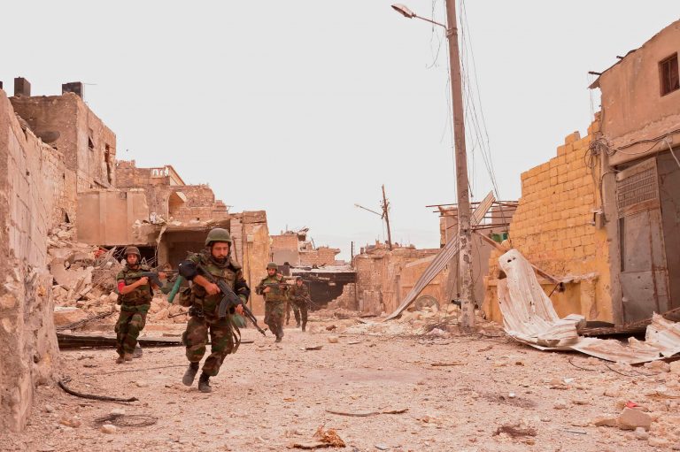 Forces loyal to Syria's President Bashar al-Assad are seen after clashes with Free Syrian Army fighters in Karm al-Gabal area in Aleppo city October 11, 2012. REUTERS/George Ourfalian/File Photo - RTX2UV21